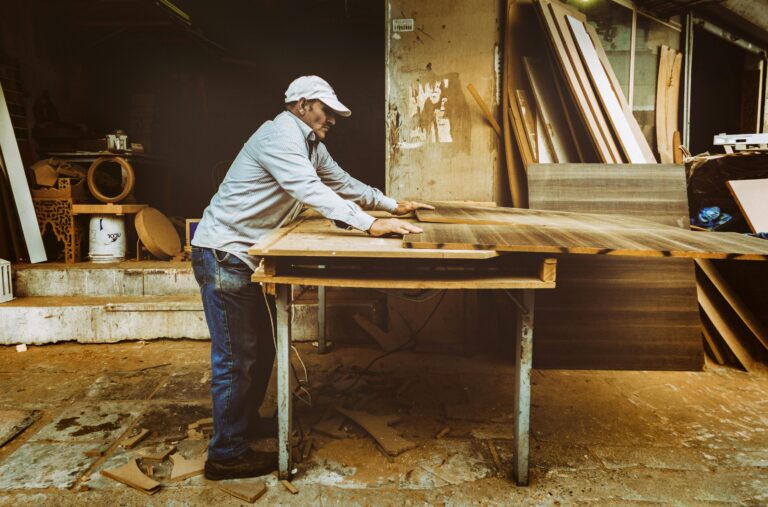 an older man working with wood